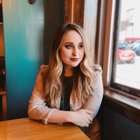 Chloe sitting at table looking our window