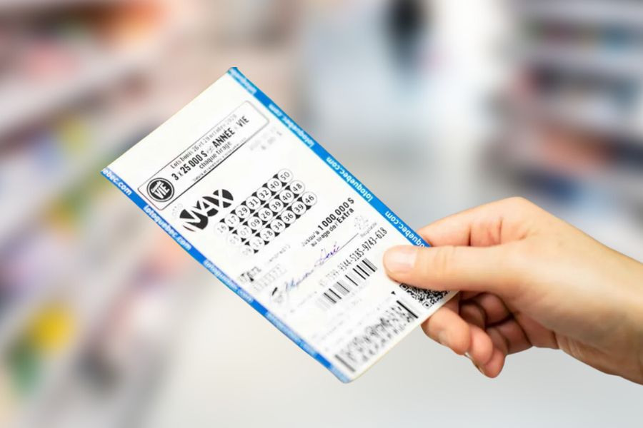 Woman hand holding Lotto Max ticket